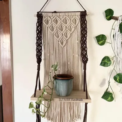 I love making pieces that are beautiful and useful! This macrame floating shelf is perfect for holding a small plant, some books, or your favorite little treasures. The dark brown and natural off-white cotton gives it a lovely contrast.