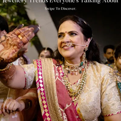 Jewelry trends aren't just for brides. Here, the mother of the groom looks absolutely radiant, embracing statement jewelry with layered necklaces and a beautiful nose ring that enhances her Simar Dugal outfit.