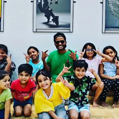 A happy moment with my amazing junior dancers after a fun Hip-Hop routine. I love seeing them grow as performers and as a team.