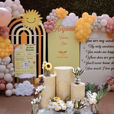A complete view of our "You Are My Sunshine" themed first birthday setup. The design features a warm, cheerful color palette, custom backdrops with heartfelt quotes, and adorable sun and cloud props to create a bright and happy celebration.
