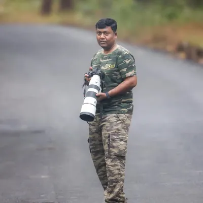In my favourite camouflage gear, with my trusty Sony A7RIV and 200-600mm lens. This is where I feel most at home, out on the road, patiently waiting for nature to reveal its stories.
