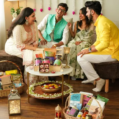 Capturing the joy of Diwali with a group of friends laughing and sharing festive treats. This lifestyle shot is all about the feeling of togetherness and celebration.