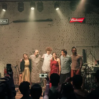 The whole band on stage at the end of a fantastic show in Mumbai. This picture captures the camaraderie and joy we share after pouring our hearts out for the audience. We are a family.