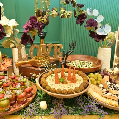 A beautiful example of our grazing table artistry, combining savory and sweet elements. Notice the mix of fresh fruits, cheeses, dips, and canapés, all arranged to invite guests to explore and indulge.