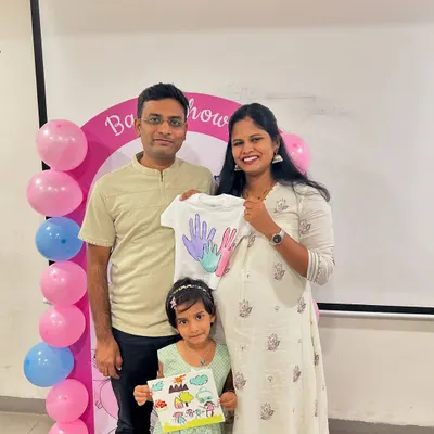 A beautiful family photo from a baby shower celebration we hosted at Aster Hospital. The family created personalized keepsakes like a painted baby t-shirt and canvas art.