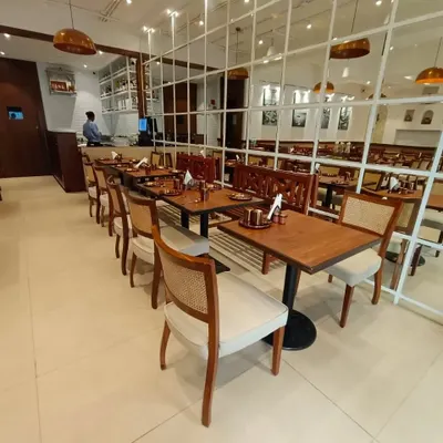 I had the opportunity to build all the furniture for The Big Fish & Co. restaurant in Dadar, Mumbai. This includes the custom dining chairs with cane backs, solid wood tables, and benches.