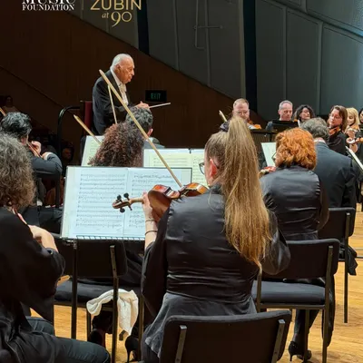 A view from within the orchestra as Maestro Zubin Mehta leads the Belgrade Philharmonic. The energy during these performances was palpable, a shared experience of musical excellence between the artists on stage and the audience.