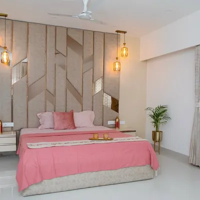 This bedroom was inspired by the idea of a serene haven. I used gentle blush tones, rich textures, and subtle metallic hints to create a sense of calm luxury. The geometric headboard serves as a stunning focal point, balanced by warm pendant lighting.