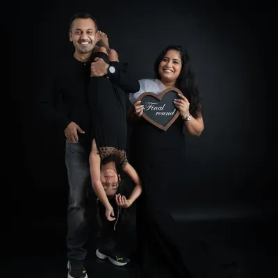 A fun and playful family portrait. I love capturing the unique personality of each family, and this shot with their daughter upside down is full of laughter and joy.