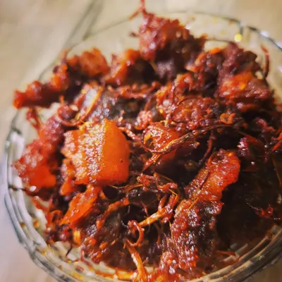 A close look at my spicy pork pickle with dry bamboo shoot and king chilli. The combination of tender meat and crunchy bamboo shoot creates a texture and taste that's super addictive.
