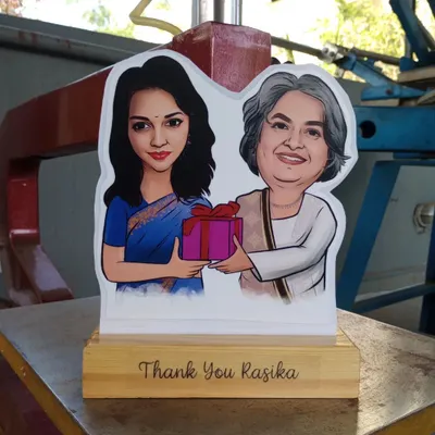 A beautiful caricature cut-out on a wooden stand, personalized with a 'Thank You' message. These make wonderful and heartfelt gifts for mentors, teachers, or colleagues.