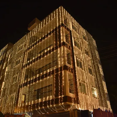 The stunning view of a venue lit up for a grand evening celebration. I capture establishing shots like this to set the scene and show the scale of your event.
