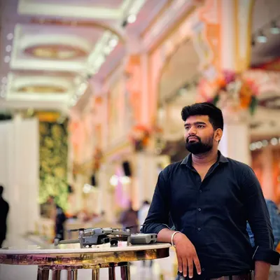 Me with my drone at a wedding venue. As a dedicated drone pilot, I am always focused on finding the next great shot to make your memories count.