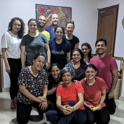 A happy group photo celebrating International Yoga Day. This is my yoga community, transformed by the practice and the connection we share.