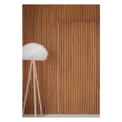 Here, the fluted teakwood wall appears as a seamless, textured surface. This detail is central to the home's design, adding visual interest while cleverly hiding a jib door to maintain a minimalist aesthetic.
