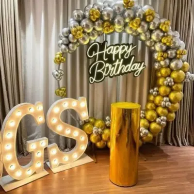 For a truly special birthday, I offer these premium setups. This one includes a full ring of metallic gold and silver balloons, a bright "Happy Birthday" neon sign, and large, light-up marquee letters for the initials. It's a glamorous photo backdrop perfect for milestone birthdays.