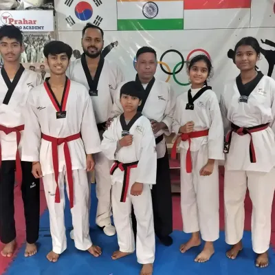 Our newly promoted black belts and red belts after a rigorous examination. This is a huge step in their Taekwondo journey.
