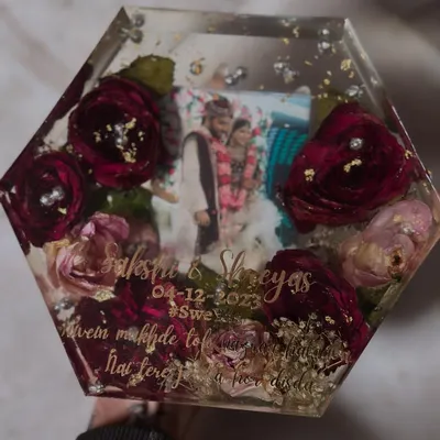 A hexagon-shaped keepsake preserving deep red wedding roses and baby's breath. This piece includes the couple's photo, names, and wedding date, making it a complete memory block.