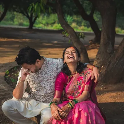 This is pure, uninhibited joy. A couple sharing a huge laugh during their portrait session. These are the authentic, unposed moments that are our absolute favorite to capture.