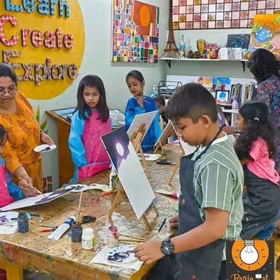 Our studio is a space to learn, create, and explore. Here, students are working on their canvas paintings, each at their own easel, focused and engaged in their work.