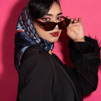 A close-up from my editorial shoot published in Opium Red Magazine. This look, inspired by 80s glamour, features a custom black blazer with feather-trimmed sleeves.