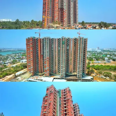 Multiple angles of the "In That Quiet Earth" high-rise towers under construction, showing the structural framework against the city skyline.