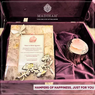 My Rose Quartz Aura Hampers are designed to share positivity. This hamper features a photo frame and candle holder crafted from authentic rose quartz, the stone of universal love, presented in a deep purple velvet box.