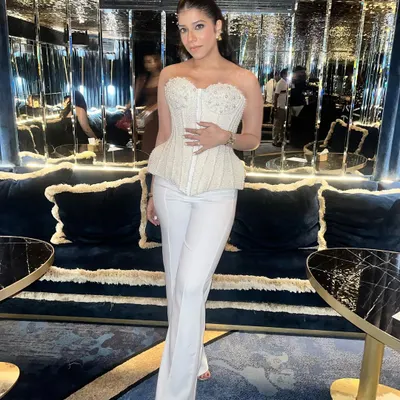 A vision in white for her anniversary celebration. I created a soft, glowing makeup look with a defined eye and a chic ponytail to complement her stunning white corset top.
