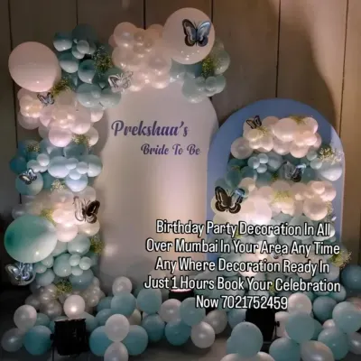 For a modern bridal shower, I designed this elegant backdrop using a cool palette of pastel blue, white, and silver balloons. The personalized "Bride to Be" sign and delicate butterfly details add a unique touch.