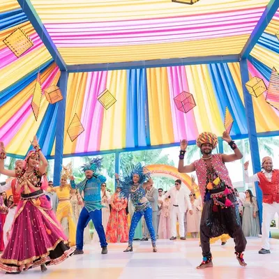 For this 'World Tour' themed carnival, we created a vibrant, high-energy dance number. The stage was a riot of color, with dancers in diverse costumes representing different cultures, making it a truly global celebration.