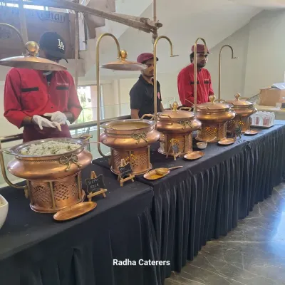 This is the standard of quality you can expect from us. I believe in making a great first impression, which is why we use this elegant brass and copper buffet setup for full-service events. It shows professionalism and care before the first guest even takes a plate.