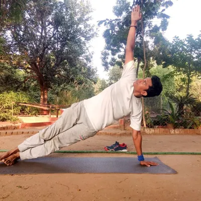 Vashishthasana, or the Side Plank Pose, is a powerful asana for building strength in the arms, wrists, and core. It teaches us that a calm mind is the source of inner strength and self-confidence, which are essential for good health.