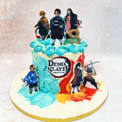 This Demon Slayer theme cake captures the series' dynamic art style with characters set against a backdrop of elemental-colored buttercream swirls.