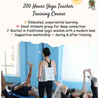Our teaching philosophy is centered on embodied, experiential learning in a small, intimate group. This image captures a moment of practice where students use straps to explore leg stretches, with an instructor guiding the class.