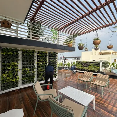 A sprawling terrace garden we designed, featuring multiple vertical gardens, comfortable seating, and hanging planters. This space is a perfect example of how a rooftop can be transformed into a lush, functional, and beautiful retreat.