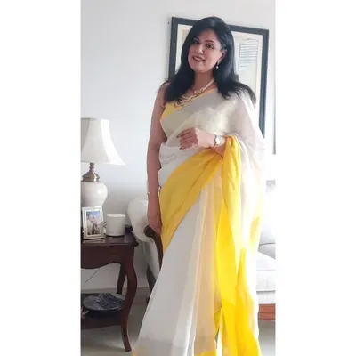 A full-length view of my white and yellow linen saree. It's lightweight, breathable, and perfect for a summer afternoon. Styling is about choosing fabrics that work for the weather and the occasion.