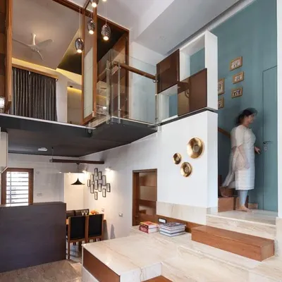 This project demonstrates our use of multi-level spaces to create dynamic interiors. The bridge connecting the upper floors becomes a functional design element that enhances the sense of volume and connection.