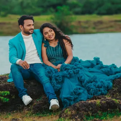 A relaxed moment from a pre-wedding shoot by the lake. I styled both the bride and groom, coordinating her ruffled teal gown with his smart-casual turquoise blazer for a cohesive look.