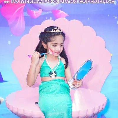 A magical transformation into a beautiful mermaid. Our unique 'Mermaids of Wooray' experience includes a complete costume and a themed backdrop, making fantasy a reality for your little one.