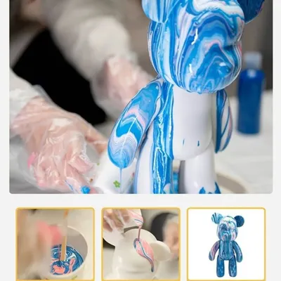 A step-by-step look at the fluid bear process, from mixing the paints to pouring them over the statue to create a marbled effect.