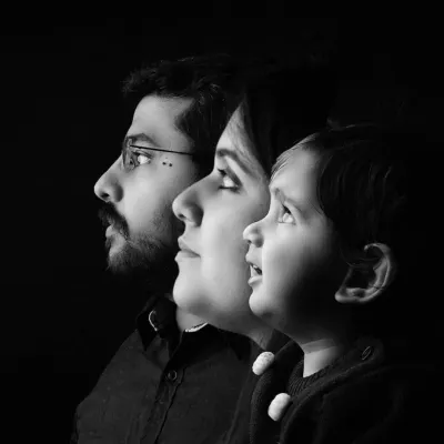 A creative black and white profile portrait showing three generations or family members in a single artistic composition. This is a powerful way to represent your family's legacy.