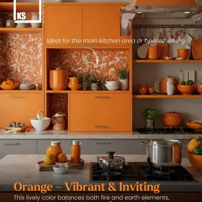 According to Vastu, orange is a vibrant and inviting color that balances fire and earth elements, creating an energizing atmosphere in the kitchen.