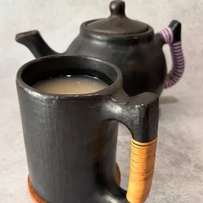 Our traditional Naga fermented rice drink served in a handcrafted Longpi pottery mug and pot. Each piece of this unique black pottery is brought all the way from Manipur to give you an authentic experience.