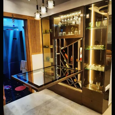 This unit serves as both a stylish bar with wine storage and a fold-out dining table. It's the perfect solution for entertaining in a compact apartment.