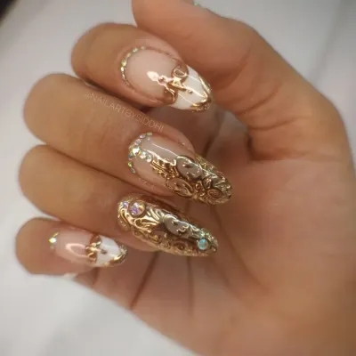 A full hand view of my signature 3D gold filigree nails. The raised, intricate scrollwork is sculpted by hand on each nail, creating a stunning, high-fashion look.