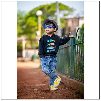 Capturing cool and confident personalities during an outdoor kids photography session in Mumbai. I let children play and be themselves, resulting in authentic and stylish portraits like this one.