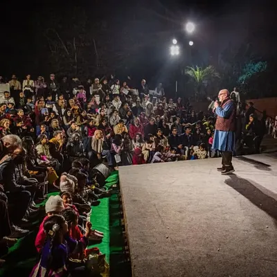 Our festival director addresses a packed house at the amphitheater. We are passionate about creating a welcoming space where the community can come together to celebrate the art of puppetry.