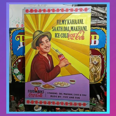A hand-painted poster featuring the legendary actor Raj Kapoor for a Coca-Cola 'Foodmarks' event, seen here in my workshop.