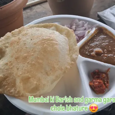 Mumbai ki Barish and garma garam chole bhature is a perfect combination. This is from our live counter at a corporate event, serving up fresh and fluffy bhature with spicy chole.