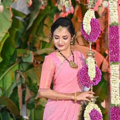 My beautiful client Gopika on her special day. She is glowing in a custom-designed two-tone lehenga, pairing a traditional brown brocade skirt with a lovely pink blouse and dupatta.